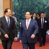 Thủ tướng Chính phủ Phạm Minh Chính gặp làm việc với Thủ tướng Chính phủ nước Cộng hòa Dân chủ Nhân dân Lào Sonexay Siphandone nhân dịp tham dự Diễn đàn Tương lai ASEAN tại Hà Nội. (Ảnh: Đức Thanh)