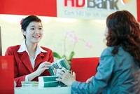 Các nhà băng đang tích cực tung ra nhiều gói
tín dụng lãi suất ưu đãi cho người vay mua nhà - Ảnh: Lê Toàn