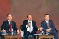 Thủ tướng Nguyễn Xuân Phúc đối thoại tại Diễn đàn kinh tế Việt Nam năm 2018. (Ảnh: Thống Nhất/TTXVN)