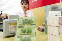 Năm 2021, ngành ngân hàng thực hiện rất nhiều giải pháp hỗ trợ doanh nghiệp, thể hiện sự đồng hành với doanh nghiệp. Ảnh: Đức Thanh