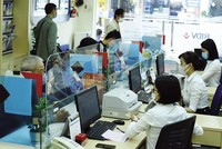 Tính đến cuối năm 2021, dư nợ cho vay nền kinh tế của BIDV đạt 1,33 triệu tỷ đồng. Ảnh: Đức Thanh