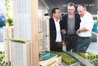Sự tái xuất của nhà đầu tư nước ngoài sẽ khiến hoạt động M&A bất động sản tăng nhiệt. Ảnh: Lê Toàn