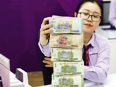 Giảm lãi suất và đơn giản điều kiện, thủ tục vay để vốn đến đúng, trúng và trực tiếp đến với doanh nghiệp. Ảnh: Đức Thanh