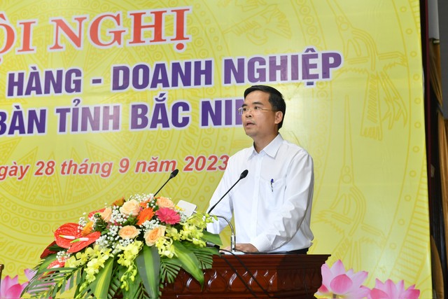 Ông Nguyễn Xuân Bắc, Phó Vụ trưởng Vụ Tín dụng các ngành kinh tế, Ngân hàng Nhà nước phát biểu tại Hội nghị ảnh 1