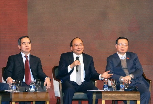 Thủ tướng Nguyễn Xuân Phúc đối thoại tại Diễn đàn kinh tế Việt Nam năm 2018. (Ảnh: Thống Nhất/TTXVN)