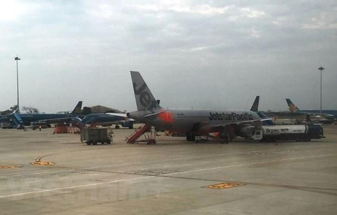 Máy bay của hai hãng hàng không Vietnam Airlines và Jetstar Pacific. (Ảnh: Việt Hùng/Vietnam+)