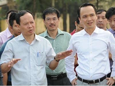 Ông Trịnh Văn Quyết, Chủ tịch HĐQT FLC (bên phải)