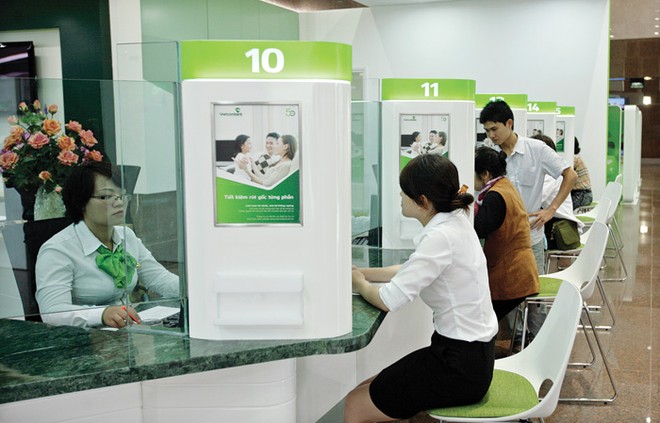 Giảm lãi suất để hỗ trợ DN, Vietcombank sẽ điều chỉnh kế hoạch lợi nhuận năm 2014 - Ảnh: Hoài Nam