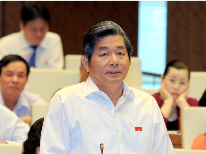Bộ trưởng Bộ Kế hoạch và Đầu tư Bùi Quang Vinh giải đáp một số ý kiến của đại biểu Quốc hội chiều 8/6/2015. Ảnh Đức Thanh