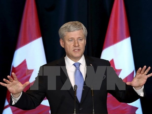 Thủ tướng Canada Stephen Harper trong cuộc họp báo về Hiệp định TPP tại Ottawa, ngày 5/10.(Nguồn: Reuters/TTXVN)