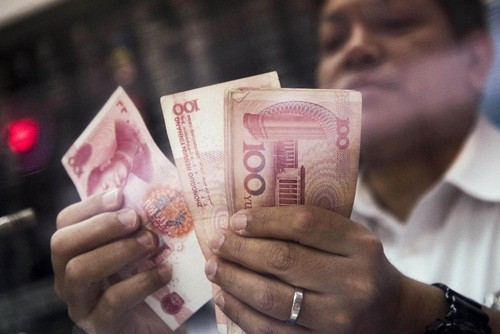 Các công ty Trung Quốc đang tích cực đổ tiền ra nước ngoài. Ảnh: Bloomberg