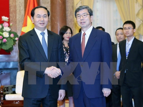 Chủ tịch nước Trần Đại Quang tiếp Chủ tịch ADB Takehiko Nakao. (Ảnh: Nhan Sáng/TTXVN)