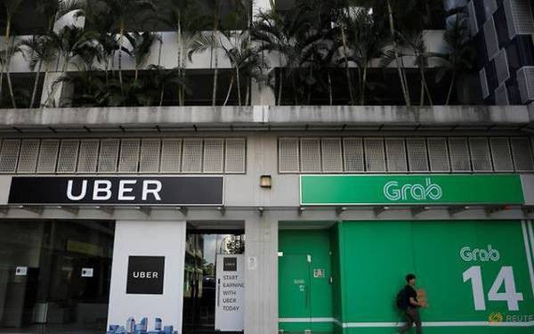 Grab và Uber bị Singapore phạt 9,5 triệu USD vì thương vụ sáp nhập.