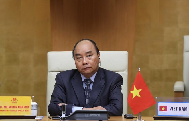 Thủ tướng Nguyễn Xuân Phúc tham dự Hội nghị thượng đỉnh trực tuyến G20 về ứng phó dịch COVID-19. (Ảnh: Thống Nhất/TTXVN).