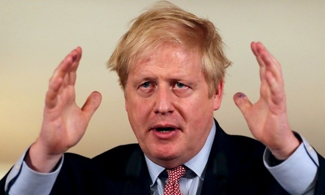 Johnson họp báo về Covid-19 tại Văn phòng Thủ tướng Anh hôm 12/3. Ảnh: Reuters.