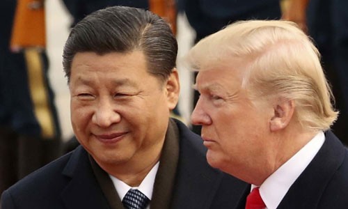 Tổng thống Mỹ Donald Trump (phải) và Chủ tịch Trung Quốc Tập Cận Bình trong cuộc gặp ở Bắc Kinh năm 2017. Ảnh:Reuters.