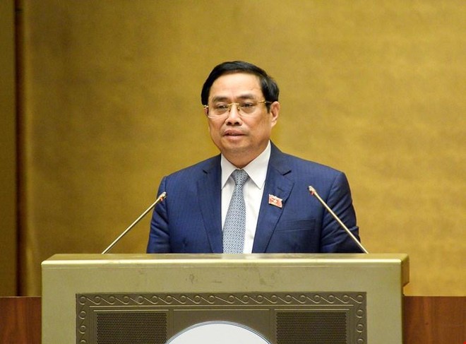 Thủ tướng Phạm Minh Chính trình bày tờ trình về cơ cấu tổ chức của Chính phủ nhiệm kỳ Quốc hội khóa XV. (Ảnh Quochoi.vn).