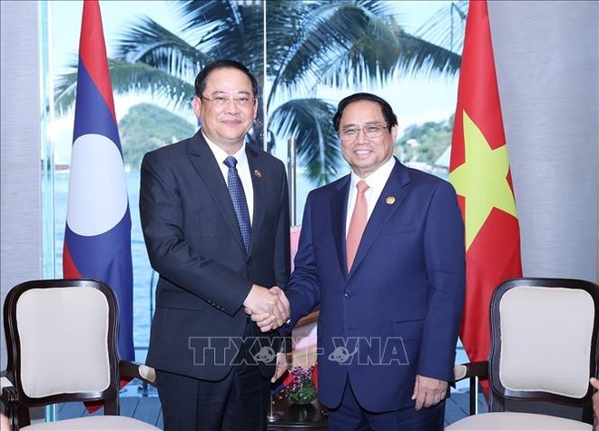 Thủ tướng Phạm Minh Chính gặp Thủ tướng Lào Sonexay Siphandone. Ảnh: Dương Giang/TTXVN