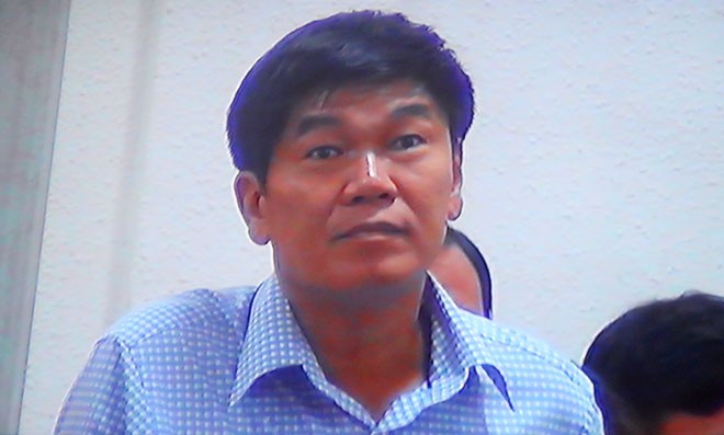 Ông Trần Đình Long tại phiên tòa xét xử bầu Kiên sáng 30/5 (ảnh chụp qua màn hình)