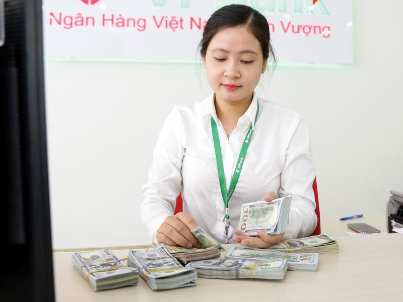 Tại Việt Nam, tỷ giá vẫn tương đối ổn định, làn sóng rút vốn ồ ạt đã không diễn ra như tại một số nước khác. Ảnh: Đức Thanh