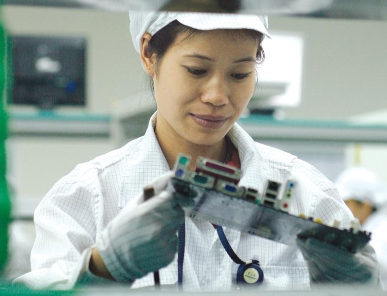 Việt Nam đã thu hút được một số tập đoàn lớn thuộc top 500 thế giới vào đầu tư. Trong ảnh: Công nhân Nhà máy Foxconn tại Bắc Giang. Ảnh: Đức Thanh