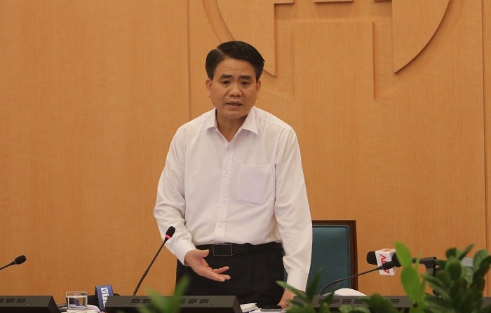 Chủ tịch UBND TP Nguyễn Đức Chung tại phiên họp sáng 30/3 .Ảnh Công Thọ
