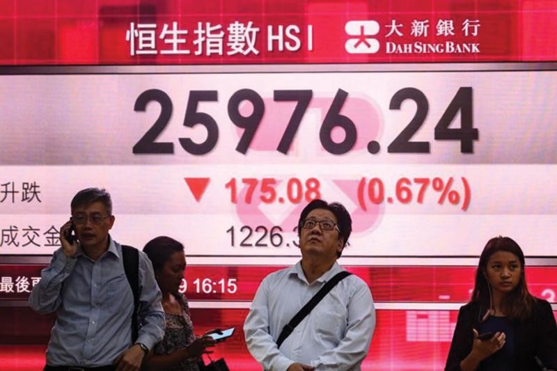 Thị trường chứng khoán Hồng Kông hầu như không bị tác động tiêu cực bởi luật an ninh mới. Ảnh: AFP