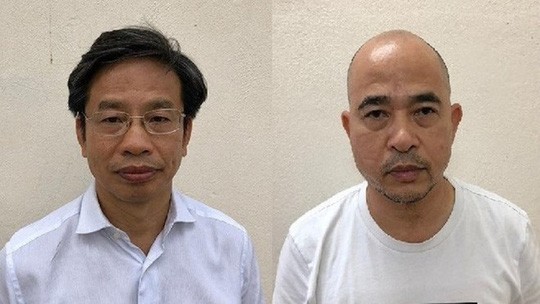 Bị can Nguyễn Xuân Sơn (trái) và Vũ Trọng Hải (phải)