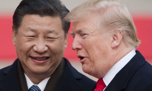 Chủ tịch Trung Quốc - Tập Cận Bình và Tổng thống Mỹ - Donald Trump tại Bắc Kinh. Ảnh: AFP.