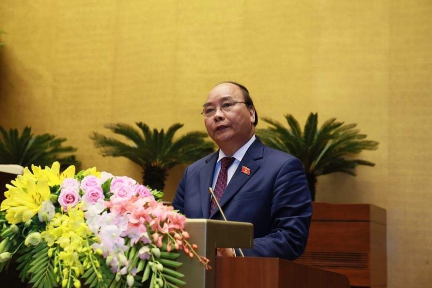 Thủ tướng Nguyễn Xuân Phúc trình bày báo cáo trước Quốc hội về tình hình kinh tế xã hội 2018 - Ảnh: VGP/Nhật Bắc.