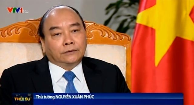 Thủ tướng Chính phủ Nguyễn Xuân Phúc trả lời phỏng vấn báo chí.