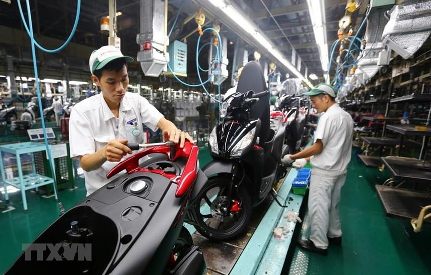 Dây chuyền lắp ráp xe gắn máy tại Công ty TNHH Honda Việt Nam, vốn đầu tư của Nhật Bản tại Vĩnh Phúc. (Ảnh: Danh Lam/TTXVN).