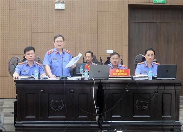 Kiểm sát viên cao cấp Nguyễn Minh Đồng tham gia đối đáp tại phiên tòa, sáng 24/8/2022. (Ảnh: Kim Anh/TTXVN).