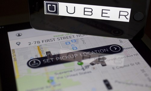 Uber Việt Nam sẽ là đơn vị kê khai vànộp thuế choUBer. Ảnh: Bloomberg.