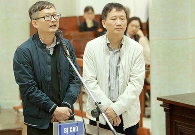 Bị cáo Đinh Mạnh Thắng (trái) và bị cáo Trịnh Xuân Thanh. Ảnh TTXVN. 