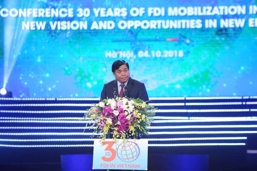 Bộ trưởng Bộ Kế hoạch và Đầu tư Nguyễn Chí Dũng phát biểu khai mại Hội nghị 30 năm thu hút FDI tại Việt Nam - Ảnh: Dũng Minh