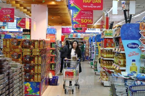 Người tiêu dùng mua sắm tại Co.op Đinh Tiên Hoàng, TP Hồ Chí Minh. Ảnh minh họa: Thanh Vũ/TTXVN