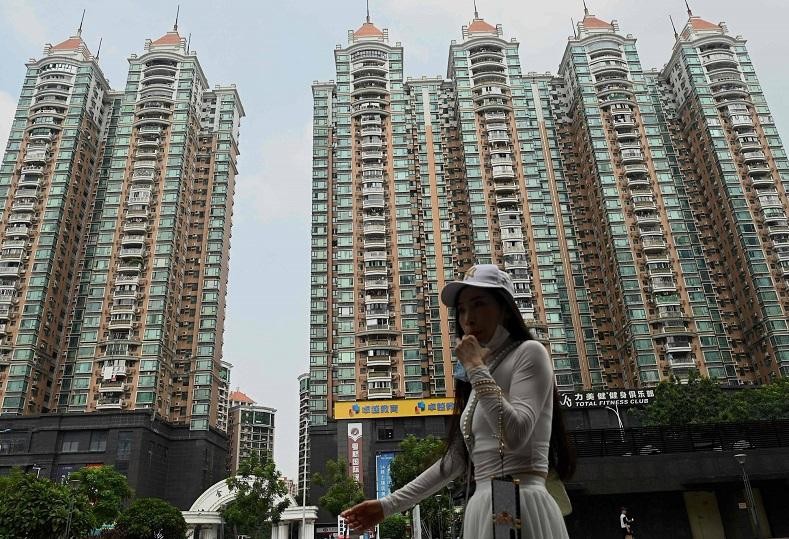 Chuyên gia của Moody’s Investor Service cho rằng, vấn đề đáng lo ngại là nền kinh tế Trung Quốc đang tăng trưởng chậm lại do sự suy thoái của ngành bất động sản nước này. Ảnh: AFP