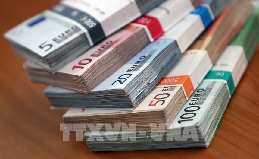 Đồng euro tại ngân hàng ở Heidelberg, Đức. Ảnh: AFP/TTXVN